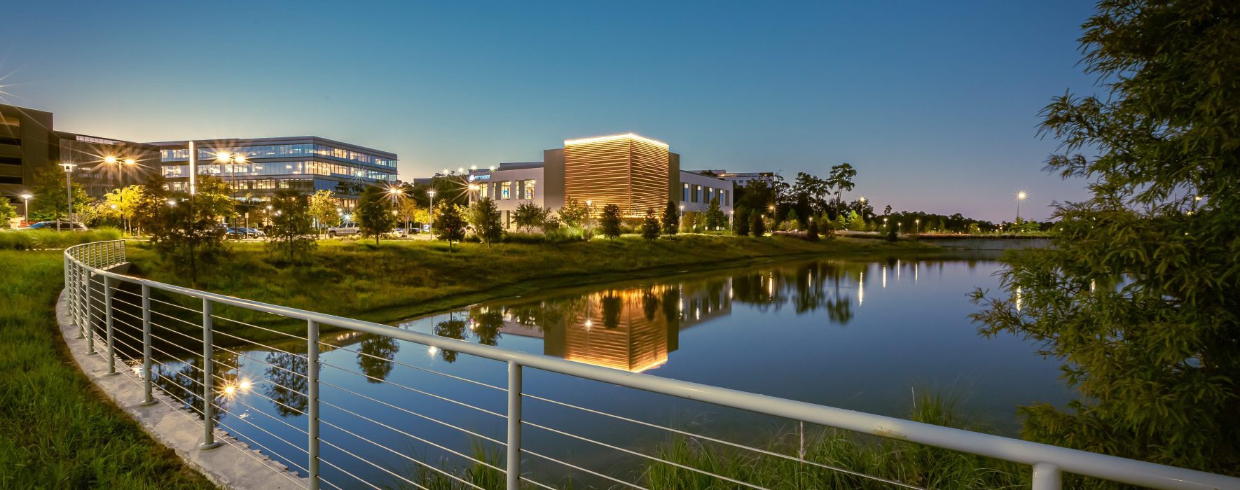 Infrastructure project at City Place Texas Landscape pond spring at dusk